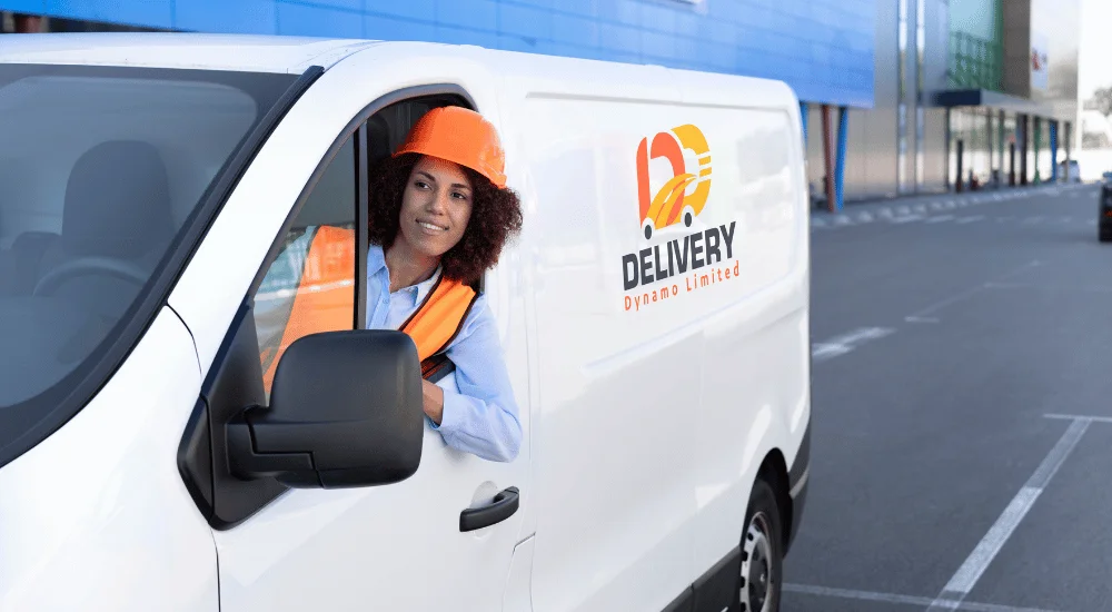 A professional moving service team in Birmingham carefully loading furniture into a truck.