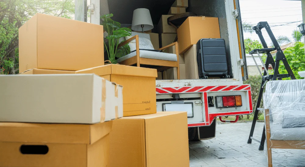 Experienced movers in Birmingham loading furniture onto a truck for safe and efficient relocation services.