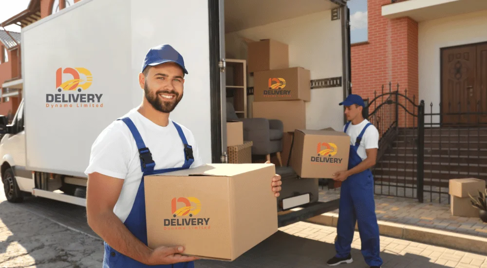 A delivery van with parcels being loaded by a courier in Birmingham, UK.